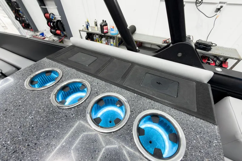 Slide: The Image of Interior of 2026 Godfrey Monaco 25' Tritoon with illuminated cup holders and sleek design. - 37