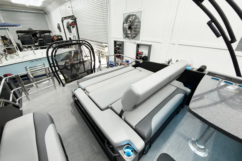 Slide: The Image of Luxurious interior of 2026 Godfrey Monaco 25' Tritoon with flip lounge seating. - 42