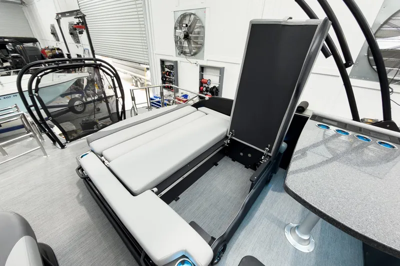 Slide: The Image of 2026 Godfrey Monaco 25' Tritoon with mid-table flip lounge, showcasing modern design and functionality. - 50