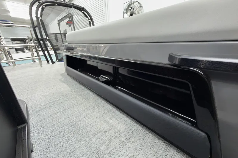 Slide: The Image of Interior view of 2026 Godfrey Monaco 25' Tritoon, featuring sleek seating and storage. - 51