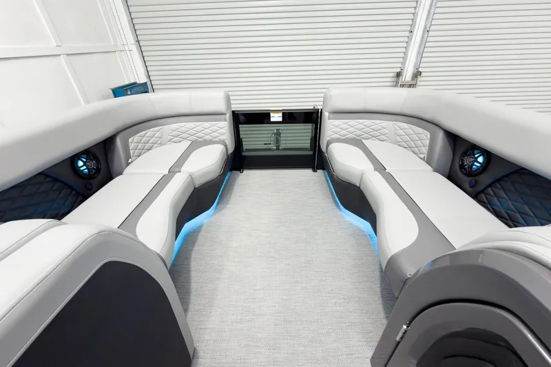 Slide: The Image of Luxurious interior of 2026 Godfrey Monaco 25' Tritoon with elegant seating and ambient lighting. - 58