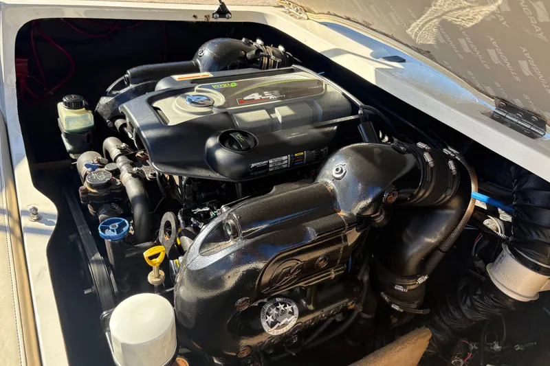 Slide: The Image of 2014 Stingray 198 LX engine compartment showcasing a Mercury 4.3L motor. - 7