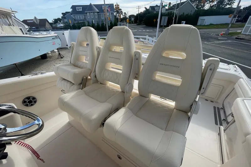 Slide: The Image of 2026 Grady-White Canyon 326 boat with luxurious seating and modern design. - 10