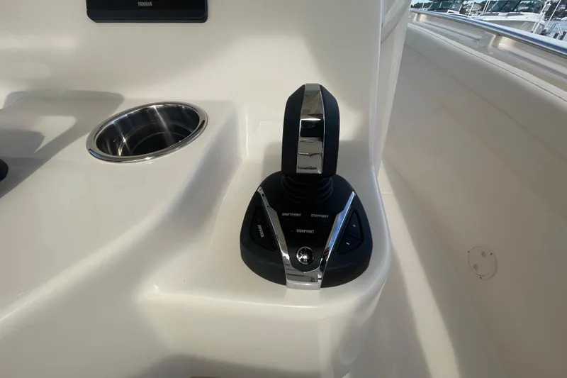 Slide: The Image of Joystick control on 2026 Grady-White Canyon 326 boat, featuring advanced navigation technology. - 13