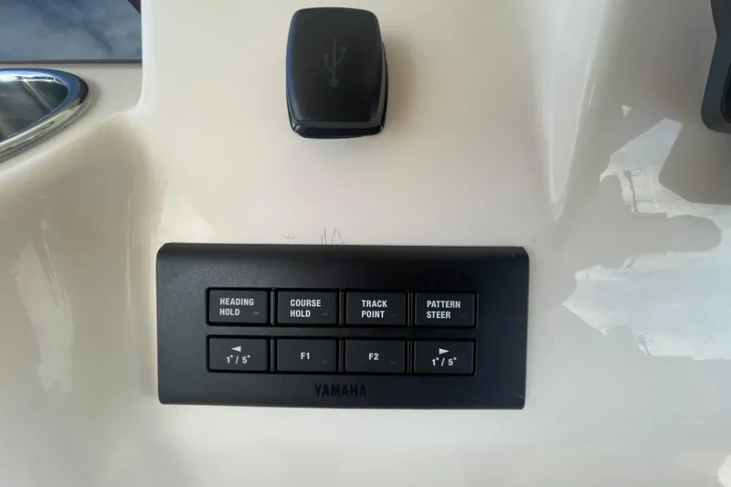 Slide: The Image of Control panel on 2026 Grady-White Canyon 326 boat with Yamaha steering functions. - 15