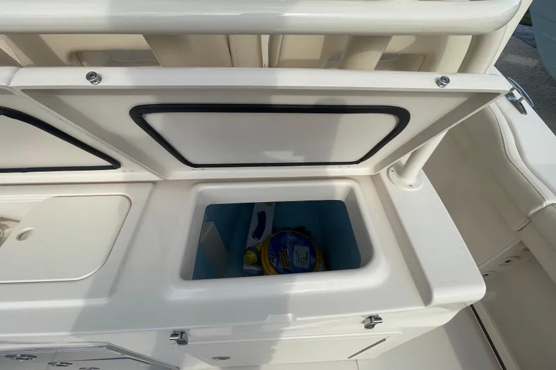 Slide: The Image of Open storage compartment on 2026 Grady-White Canyon 326 boat. - 18