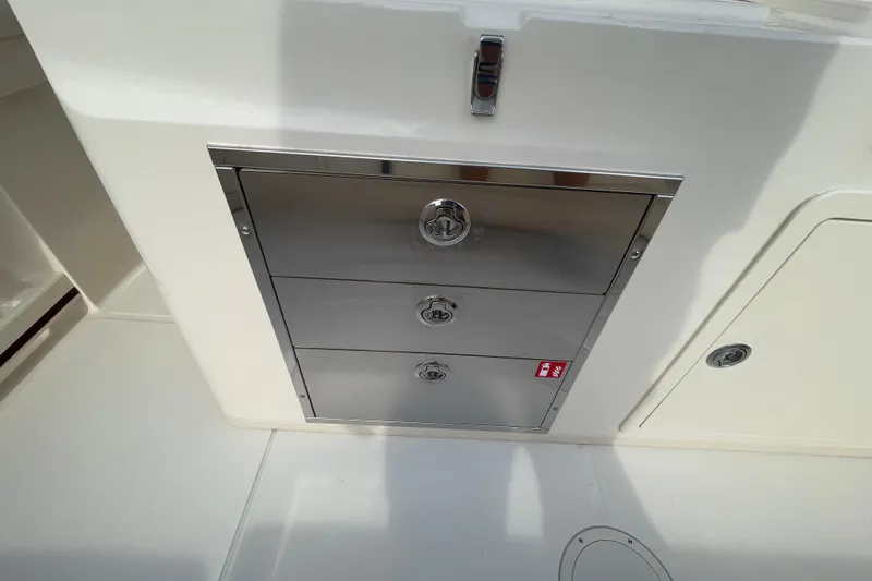 Slide: The Image of Stainless steel storage drawers on 2026 Grady-White Canyon 326 boat. - 20