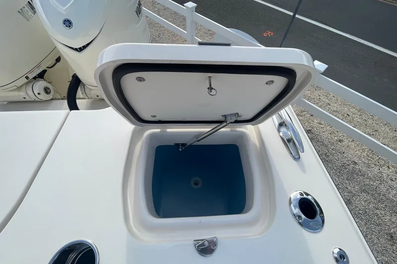 Slide: The Image of Open hatch on 2026 Grady-White Canyon 326 boat, revealing storage compartment. - 22