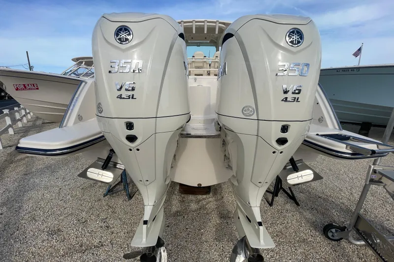 Slide: The Image of 2026 Grady-White Canyon 326 with twin Yamaha 350 V6 outboard engines, displayed for sale. - 24