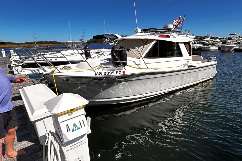 Slide: The Image of 2014 Cutwater C-28 boat docked at marina, sunny day, clear blue sky. - 1