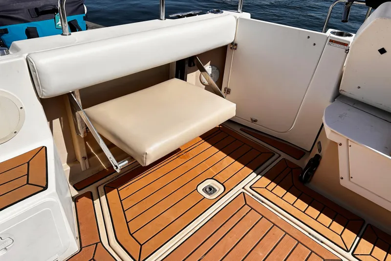 Slide: The Image of 2014 Cutwater C-28 boat interior with foldable seat and teak flooring. - 10