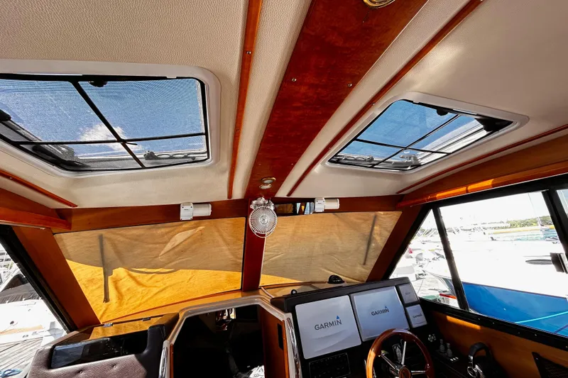 Slide: The Image of Interior view of 2014 Cutwater C-28 boat cockpit with Garmin navigation screens. - 15