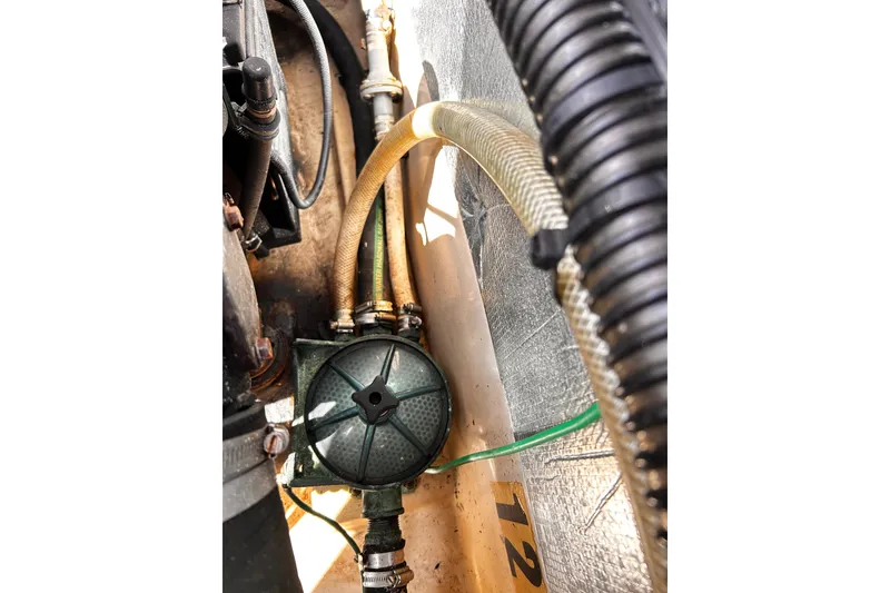 Slide: The Image of Engine compartment of a 2014 Cutwater C-28 boat showing hoses and mechanical components. - 32