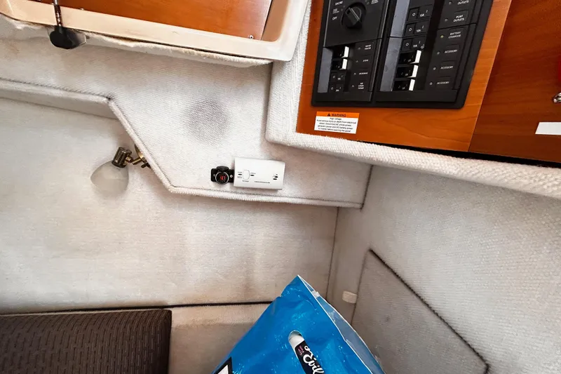 Slide: The Image of Interior of a 2014 Cutwater C-28 boat showing control panel and light fixture. - 37