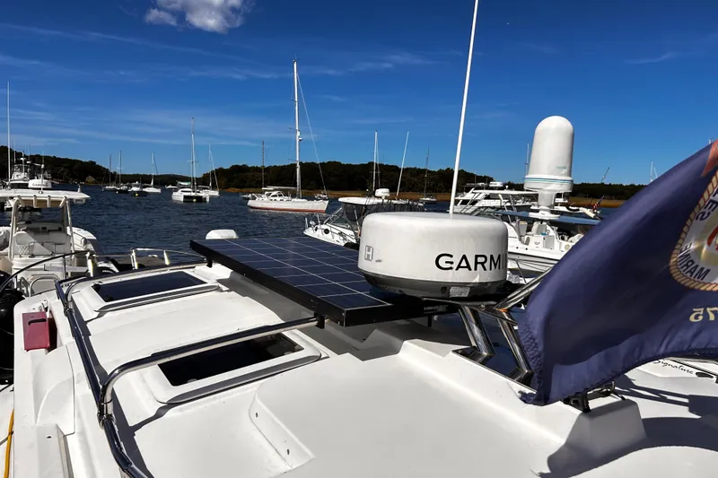 Slide: The Image of 2014 Cutwater C-28 boat with Garmin radar and solar panel, docked in a marina. - 6