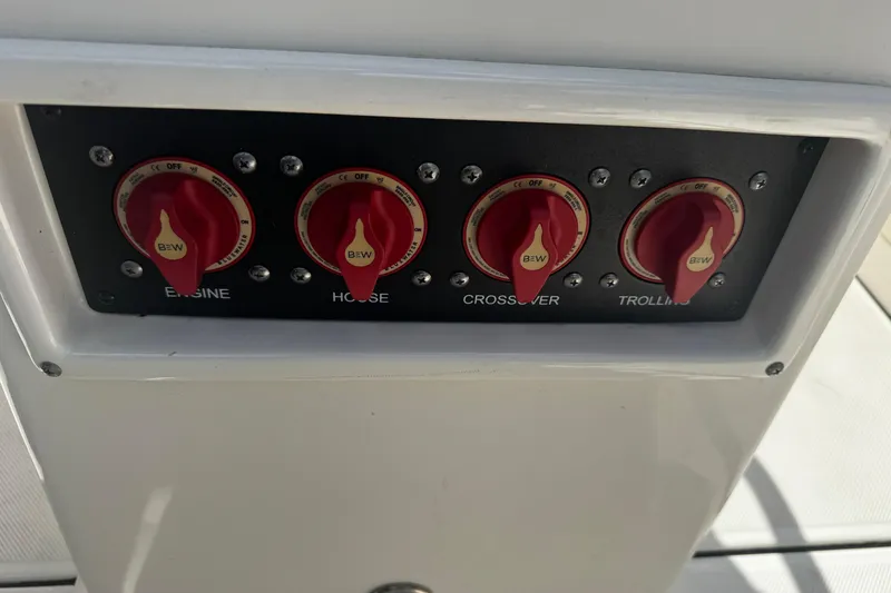 Slide: The Image of Control panel of 2023 Sea Born FX22 Bay boat with red switches. - 14