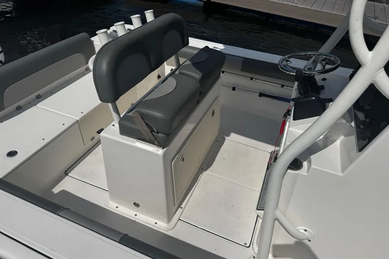 Slide: The Image of 2023 Sea Born FX22 Bay boat interior with seating and steering console. - 6