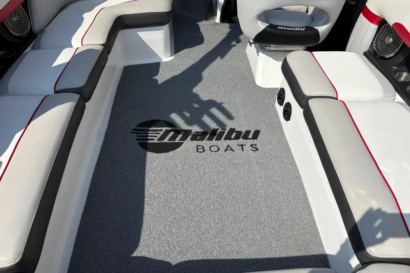 Slide: The Image of Interior of 2016 Malibu Wakesetter 24 MXZ boat with logo on carpet. - 11