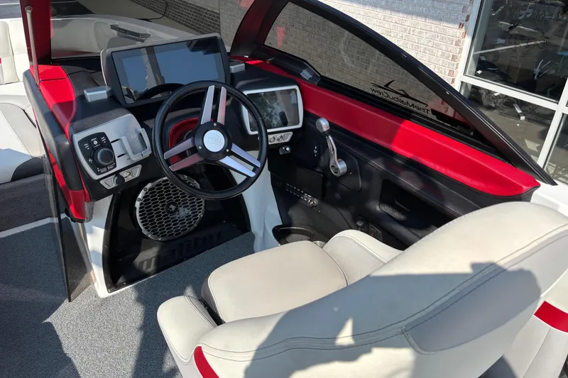 Slide: The Image of Interior of 2016 Malibu Wakesetter 24 MXZ boat with modern dashboard and steering wheel. - 9