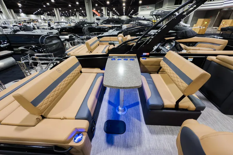 Slide: The Image of 2026 Godfrey Monaco 255 boat interior with luxurious seating and mid-table lounge. - 18