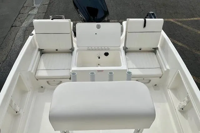 Slide: The Image of 2025 Bayliner Trophy T18 boat interior with seating and storage compartments. - 13