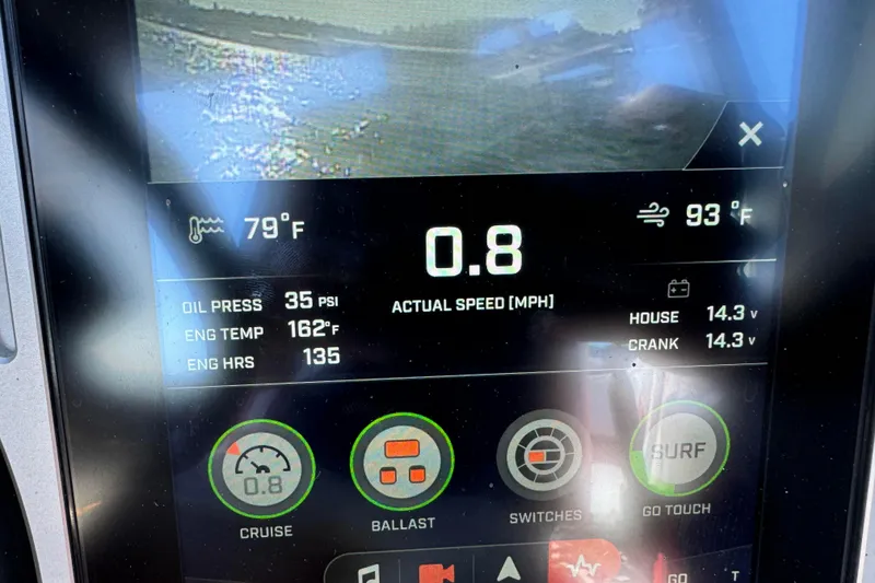 Slide: The Image of Dashboard of a 2022 Tigé 25ZX boat displaying speed, temperature, and engine metrics. - 12