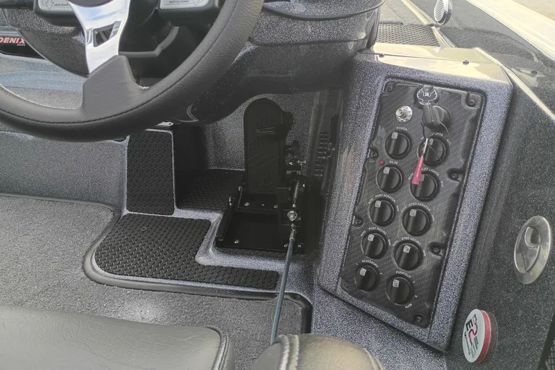 Slide: The Image of Phoenix 921 ELITEX 2026 dashboard with steering wheel and control panel. - 7