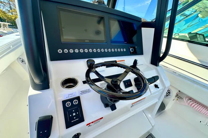 Slide: The Image of 2026 Regulator 31 boat dashboard with modern controls and dual screens. - 10