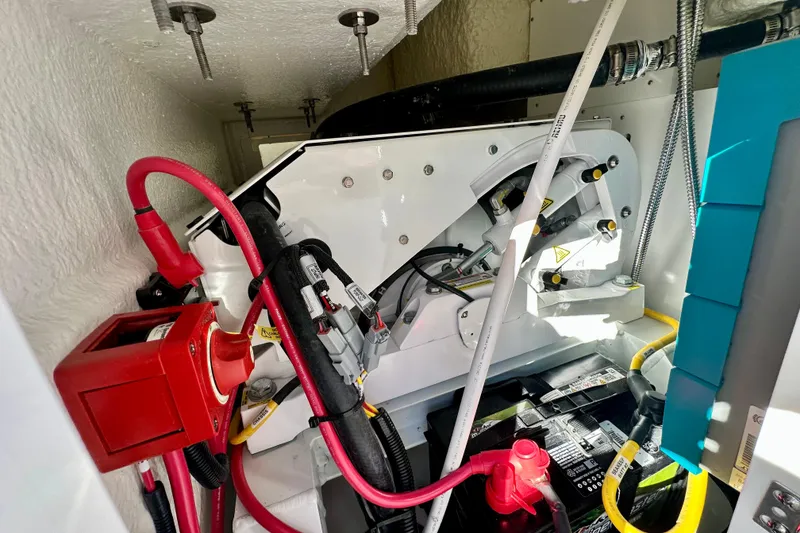 Slide: The Image of Interior view of a 2026 Regulator 31 boat's engine compartment with wiring and components. - 16