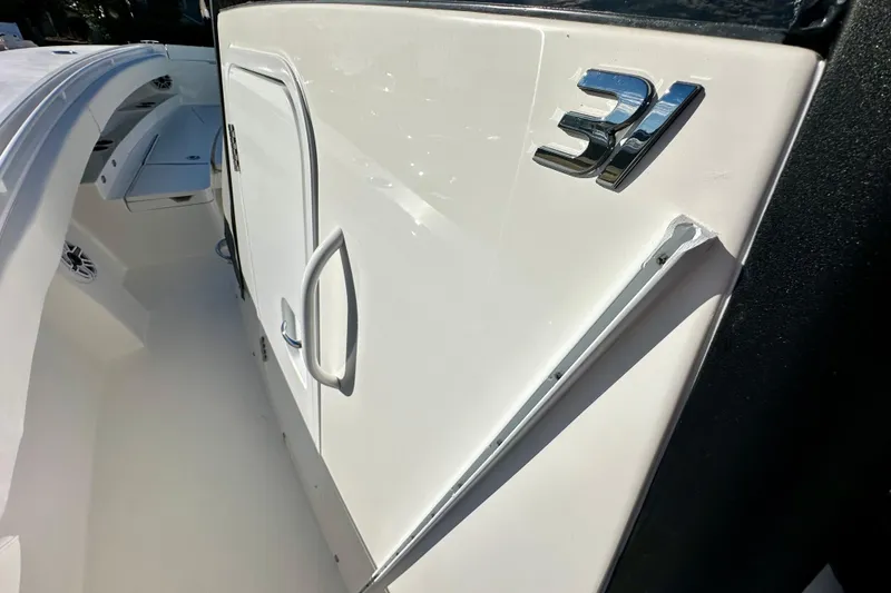 Slide: The Image of 2026 Regulator 31 boat interior with sleek white design and chrome details. - 17