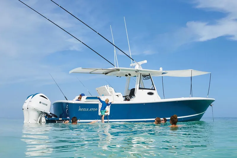 Slide: The Image of 2026 Regulator 31 boat with sleek chrome lettering on the side. - 2