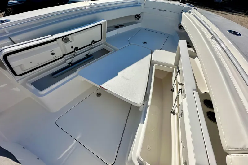 Slide: The Image of 2026 Regulator 31 boat interior with open storage compartments and seating area. - 20