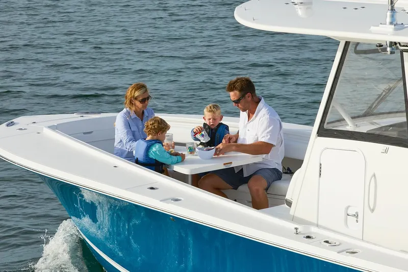 Slide: The Image of 2026 Regulator 31 boat with Yamaha XTO Offshore engine in a sunny outdoor setting. - 4