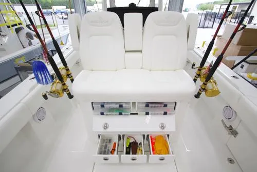 Slide: The Image of 2026 Regulator 31 boat interior with storage compartments and seating area. - 7