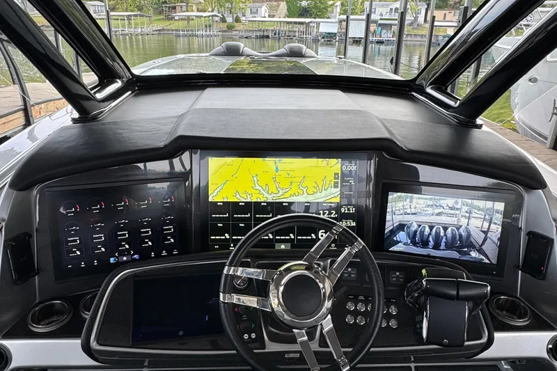 Slide: The Image of 2024 MTI 50v interior with blue LED lighting and sleek storage compartment. - 12