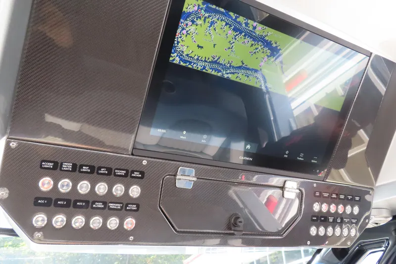 Slide: The Image of 2024 MTI 50v boat dashboard with navigation screen and speakers. - 18