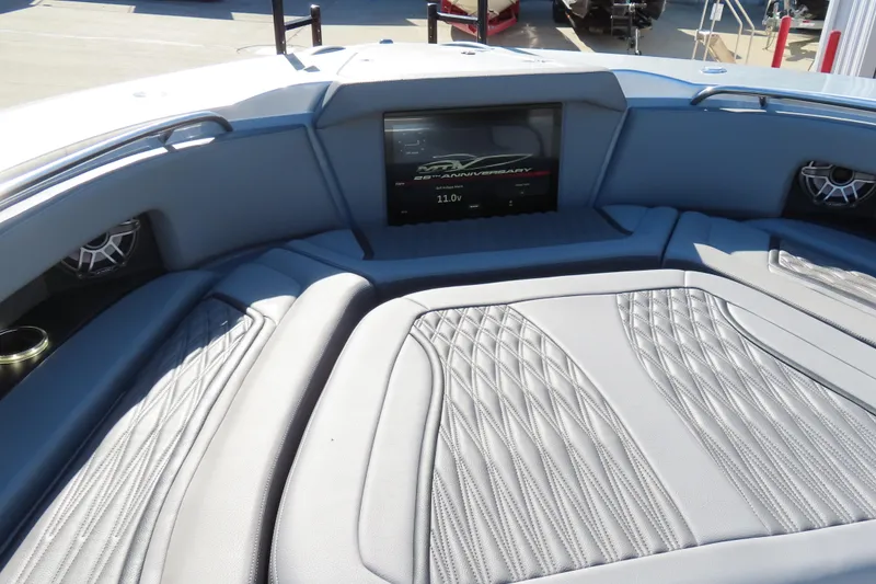 Slide: The Image of Luxury seating on 2024 MTI 50v boat with gray leather upholstery and scenic background. - 20