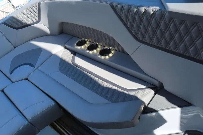 Slide: The Image of 2024 MTI 50v boat interior with luxurious seating and powerful outboard engines. - 32