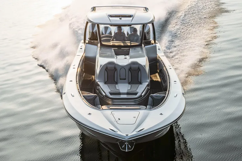 Slide: The Image of 2024 MTI 50v boat with five powerful outboard engines, parked in a marina. - 4