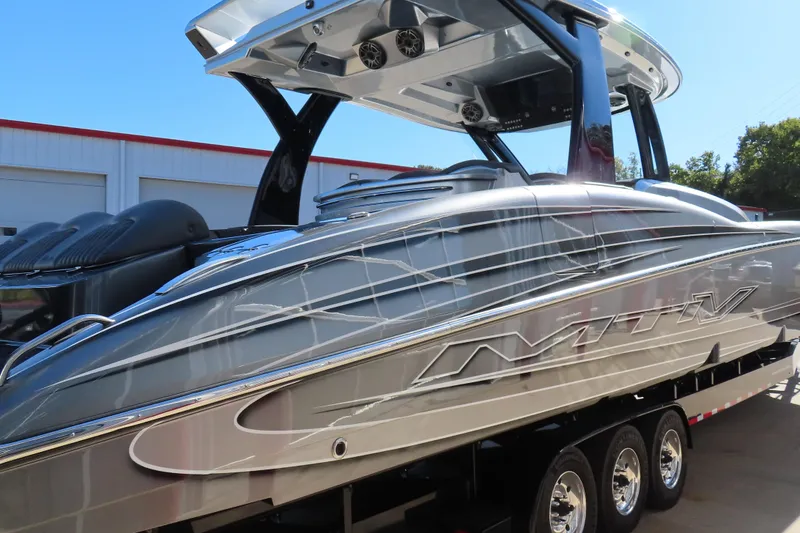 Slide: The Image of Luxurious seating on 2024 MTI 50v boat, featuring sleek gray upholstery and modern design. - 41