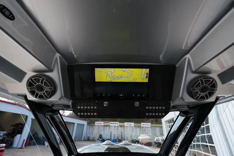 Slide: The Image of 2024 MTI 50v boat interior with navigation screen and speakers. - 47