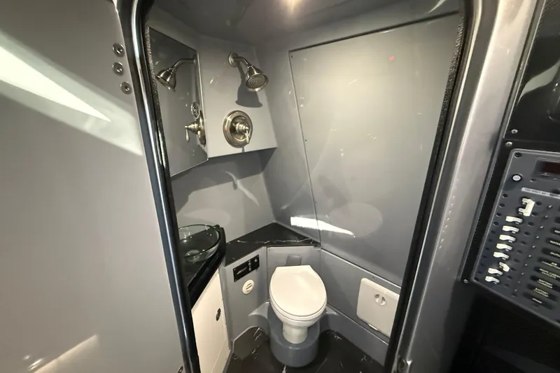 Slide: The Image of Modern bathroom in 2024 MTI 50v model with shower, toilet, and control panel. - 48