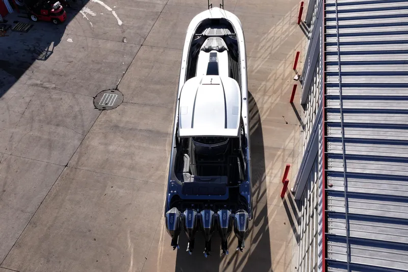 Slide: The Image of Aerial view of 2024 MTI 50v boat with multiple engines docked. - 59