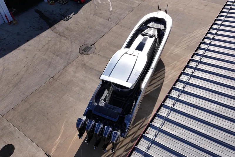 Slide: The Image of Aerial view of 2024 MTI 50v boat with multiple outboard engines on concrete surface. - 68
