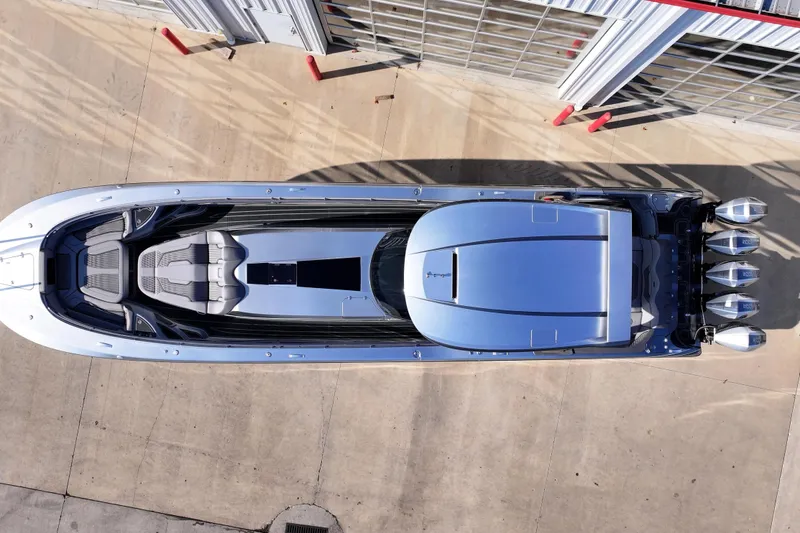 Slide: The Image of Aerial view of 2024 MTI 50v boat with sleek design and powerful engines. - 69