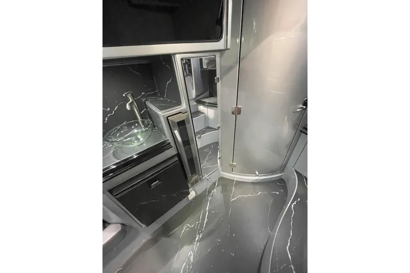 Slide: The Image of Modern bathroom sink with glass bowl in 2024 MTI 50v model. - 9