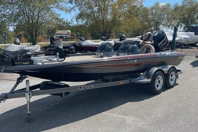 Slide: The Image of 2015 Bass Cat Pantera II boat on trailer, parked outdoors. - 10