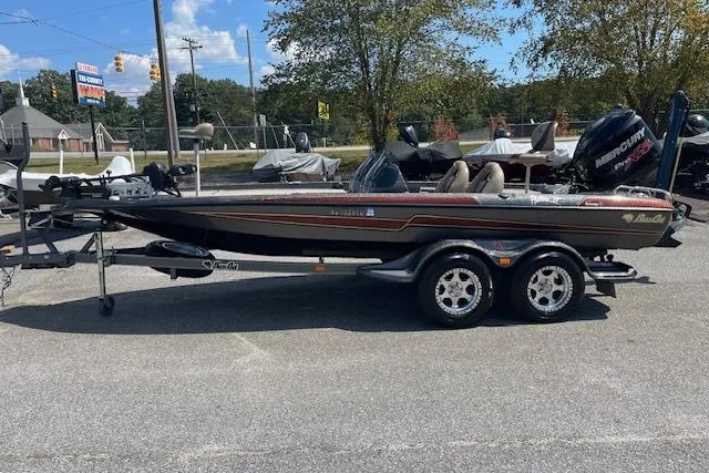 Slide: The Image of 2015 Bass Cat Pantera II boat on trailer, parked outdoors on a sunny day. - 11