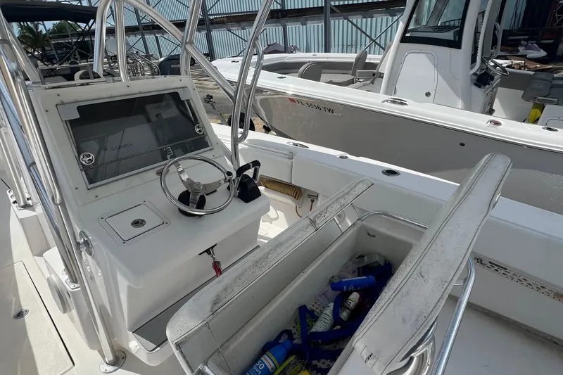 Slide: The Image of 2012 SeaHunter 29 boat cockpit with Garmin navigation and storage compartment. - 10
