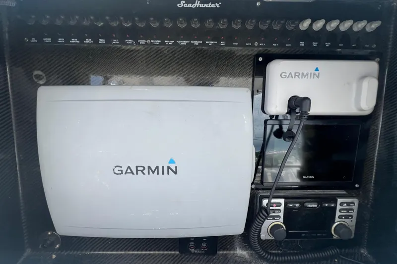 Slide: The Image of Control panel of a 2012 SeaHunter 29 boat with Garmin navigation equipment. - 12